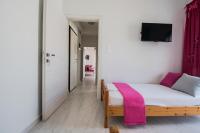 Posteľ alebo postele v izbe v ubytovaní Chelona Apartments