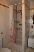 a bathroom with a shower and a toilet and a sink at Marco Polo in Horbourg