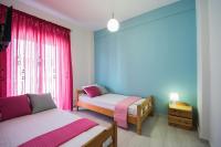 Posteľ alebo postele v izbe v ubytovaní Chelona Apartments