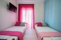 Posteľ alebo postele v izbe v ubytovaní Chelona Apartments