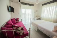 Posteľ alebo postele v izbe v ubytovaní Chelona Apartments