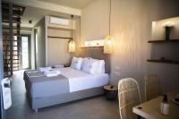 Posteľ alebo postele v izbe v ubytovaní Theros Suites