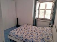A bed or beds in a room at La casetta dei limoni