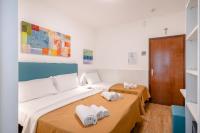 Łóżko lub łóżka w pokoju w obiekcie Hotel Royal Garnì