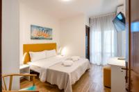Łóżko lub łóżka w pokoju w obiekcie Hotel Royal Garnì