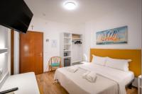 Łóżko lub łóżka w pokoju w obiekcie Hotel Royal Garnì