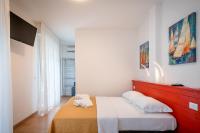 Łóżko lub łóżka w pokoju w obiekcie Hotel Royal Garnì