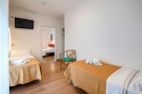 Łóżko lub łóżka w pokoju w obiekcie Hotel Royal Garnì