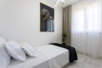 Postel nebo postele na pokoji v ubytování Apartments Taratta 1