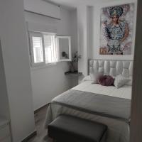 Postel nebo postele na pokoji v ubytování Apartamentos Sol y Luna Conil