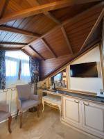 A television and/or entertainment centre at Castle Old Town Hotel