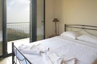 A bed or beds in a room at Papadeas Villas