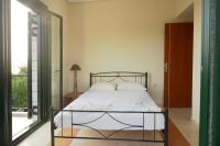A bed or beds in a room at Papadeas Villas