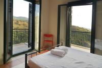 A bed or beds in a room at Papadeas Villas