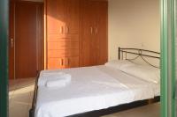 A bed or beds in a room at Papadeas Villas