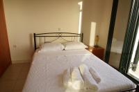 A bed or beds in a room at Papadeas Villas