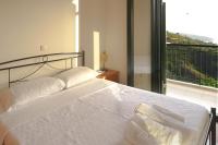 A bed or beds in a room at Papadeas Villas