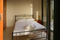 A bed or beds in a room at Papadeas Villas