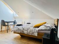 Postel nebo postele na pokoji v ubytování Apartmány v ráji (Českém)