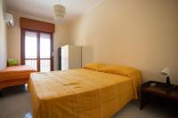 Posteľ alebo postele v izbe v ubytovaní Casa Amodeo