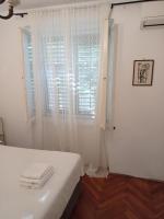 Posteľ alebo postele v izbe v ubytovaní Damjan Rooms