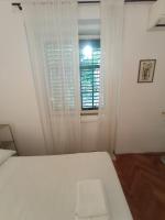 Posteľ alebo postele v izbe v ubytovaní Damjan Rooms