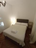 Posteľ alebo postele v izbe v ubytovaní Damjan Rooms