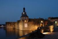 a building with a clock tower on top of it at Studio Cosy in Concarneau