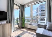 Televízia a/alebo spoločenská miestnosť v ubytovaní Apartament 12. Piętro - ACCO RENT