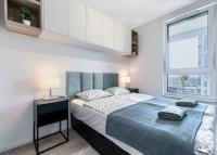 Posteľ alebo postele v izbe v ubytovaní Apartament 12. Piętro - ACCO RENT