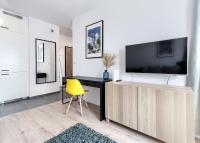 Televízia a/alebo spoločenská miestnosť v ubytovaní Apartament 12. Piętro - ACCO RENT