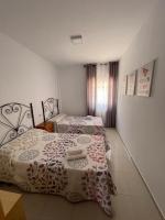 Posteľ alebo postele v izbe v ubytovaní Atico HouseGom