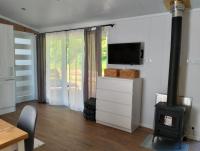 TV a/nebo společenská místnost v ubytování Tiny house