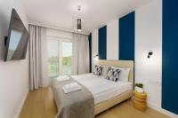 Łóżko lub łóżka w pokoju w obiekcie Klif Apartamenty Polanki Aqua A414