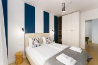 Łóżko lub łóżka w pokoju w obiekcie Klif Apartamenty Polanki Aqua A414