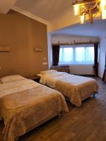 A bed or beds in a room at Mersu A'la Konak Otel