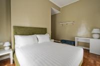 A bed or beds in a room at The river corner