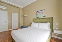 A bed or beds in a room at The river corner