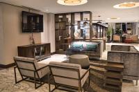 a lobby of a hotel with chairs and a couch at Holiday Inn Toronto Downtown Centre by IHG in Toronto