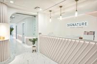 a reception area of a dermatology clinic with a potted plant at Holiday Inn Toronto Downtown Centre by IHG in Toronto