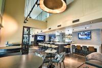 a restaurant with tables and chairs and a bar at Holiday Inn Toronto Downtown Centre by IHG in Toronto