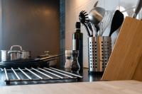 a kitchen counter with utensils and a container of utensils at City apartment 3 BEDROOM, KITCHEN, WIFI, WORKSPACE, COFFEE, Central in Hasselt