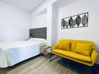 Postel nebo postele na pokoji v ubytování Apartamentos Turísticos Santo Rostro