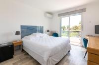 Łóżko lub łóżka w pokoju w obiekcie HOTEL LA QUIETUDE