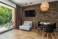 Televízia a/alebo spoločenská miestnosť v ubytovaní Czarna Perła- Apartament przy Solisku