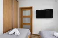 Televízia a/alebo spoločenská miestnosť v ubytovaní Czarna Perła- Apartament przy Solisku