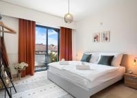 a bedroom with a large bed and a large window at City apartment 3 BEDROOM, KITCHEN, WIFI, WORKSPACE, COFFEE, Central in Hasselt