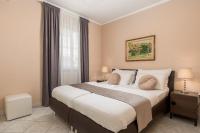 Posteľ alebo postele v izbe v ubytovaní Apartments Villa Chiara Opatija