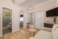 Televízia a/alebo spoločenská miestnosť v ubytovaní Apartments Villa Chiara Opatija