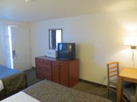 a bedroom with a bed and a tv on a dresser at Bryce View Lodge Part of the Ruby's Inn Resort in Bryce Canyon